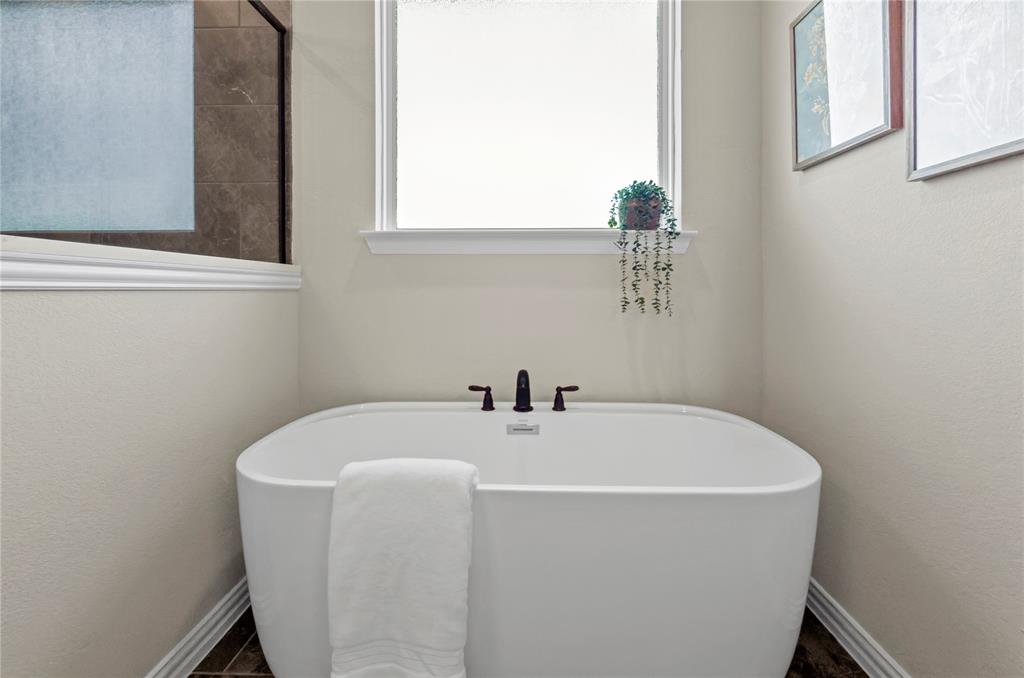 205 Stuart Paradise, TX 76073 - Photo 20 of 33 a white bath tub sitting next to a window