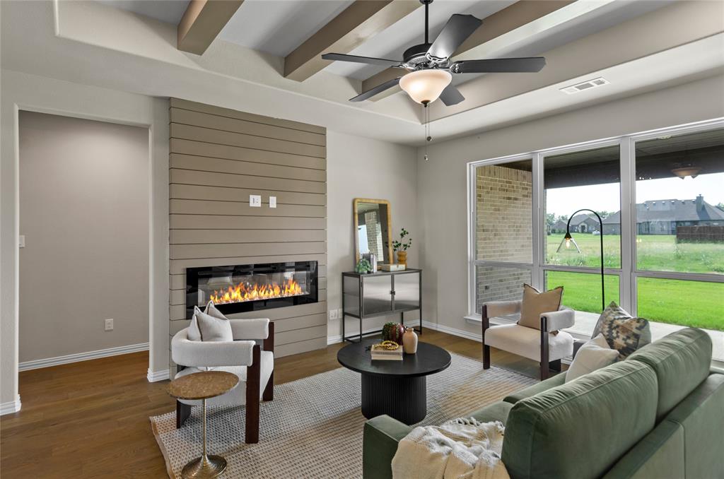 205 Stuart Paradise, TX 76073 - Photo 2 of 33 a living room with furniture and a fireplace