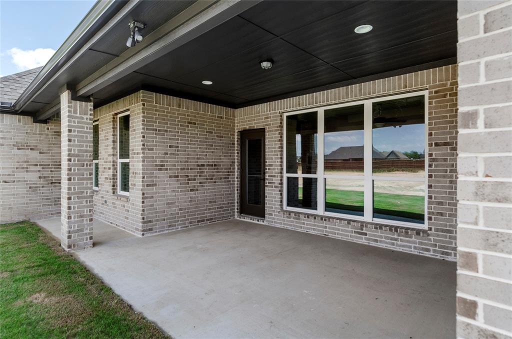 205 Stuart Paradise, TX 76073 - Photo 28 of 33 a view of a house with a large window