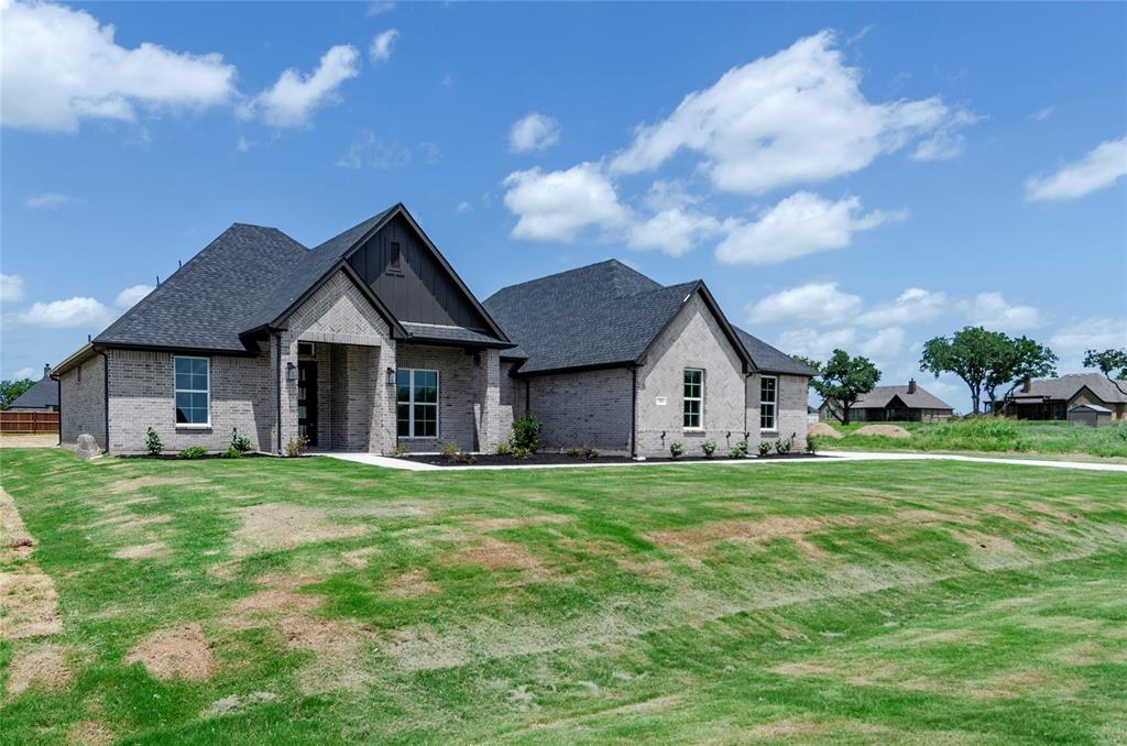 205 Stuart Paradise, TX 76073 - Photo 4 of 33 a front view of house with yard and green space