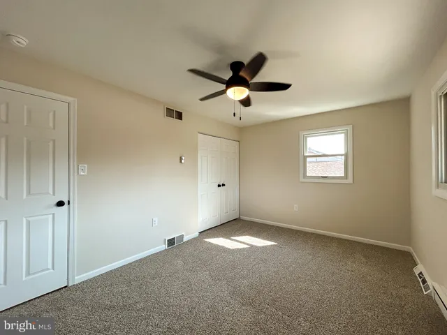 a view of a big room with carpet