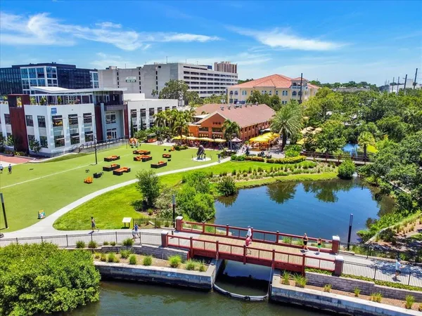 a terrace with outdoor seating and city view