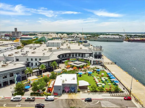 an aerial view of a houses with a yard