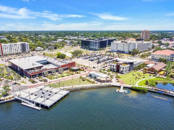 an aerial view of a houses with a lake view