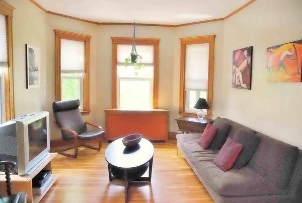 90 Montebello Road, Unit 3 Boston, MA 02130 - Photo 3 of 11 a living room with furniture and a large window