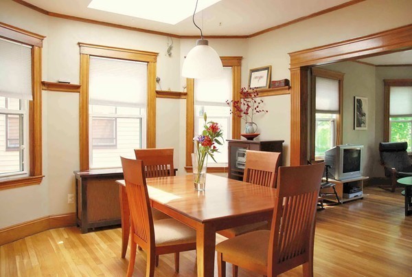 90 Montebello Road, Unit 3 Boston, MA 02130 - Photo 4 of 11 a view of a dining room with furniture window and wooden floor