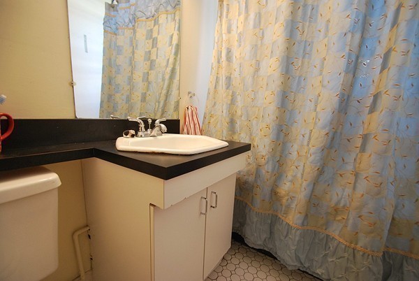 90 Montebello Road, Unit 3 Boston, MA 02130 - Photo 7 of 11 a bathroom with a sink and a mirror