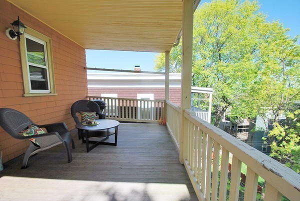 90 Montebello Road, Unit 3 Boston, MA 02130 - Photo 8 of 11 a view of a chair and tables in the balcony