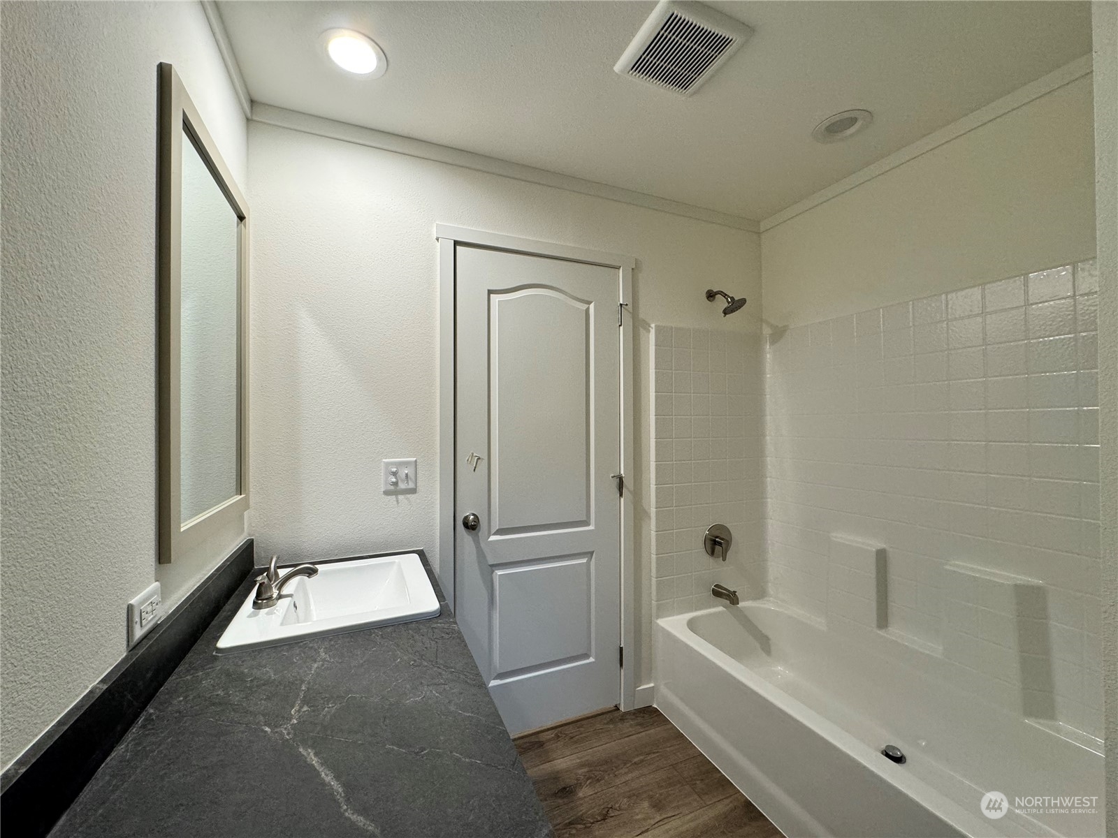 122 Ward Road Longview, WA 98632 - Photo 12 of 21 a spacious bathroom with a tub shower and a sink