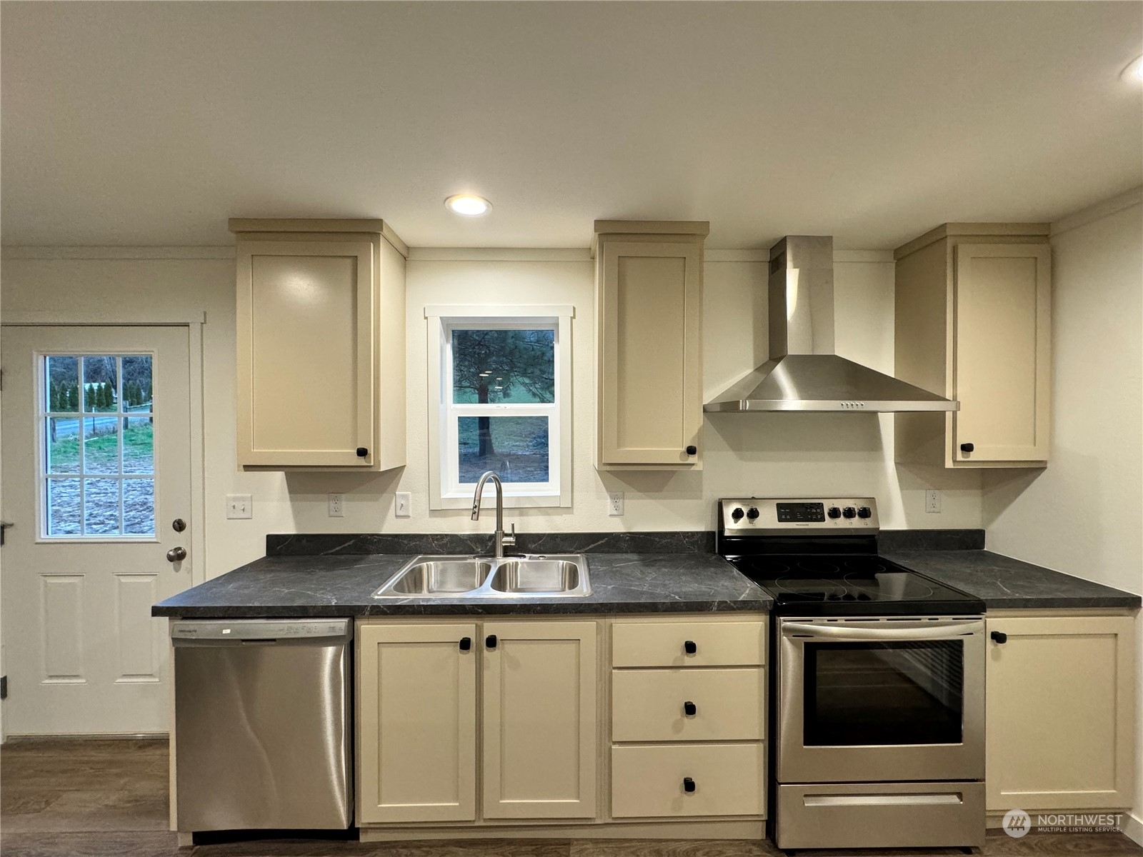 122 Ward Road Longview, WA 98632 - Photo 8 of 21 a kitchen with granite countertop a sink a stove and cabinets