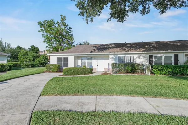 a view of a front of a house with a yard