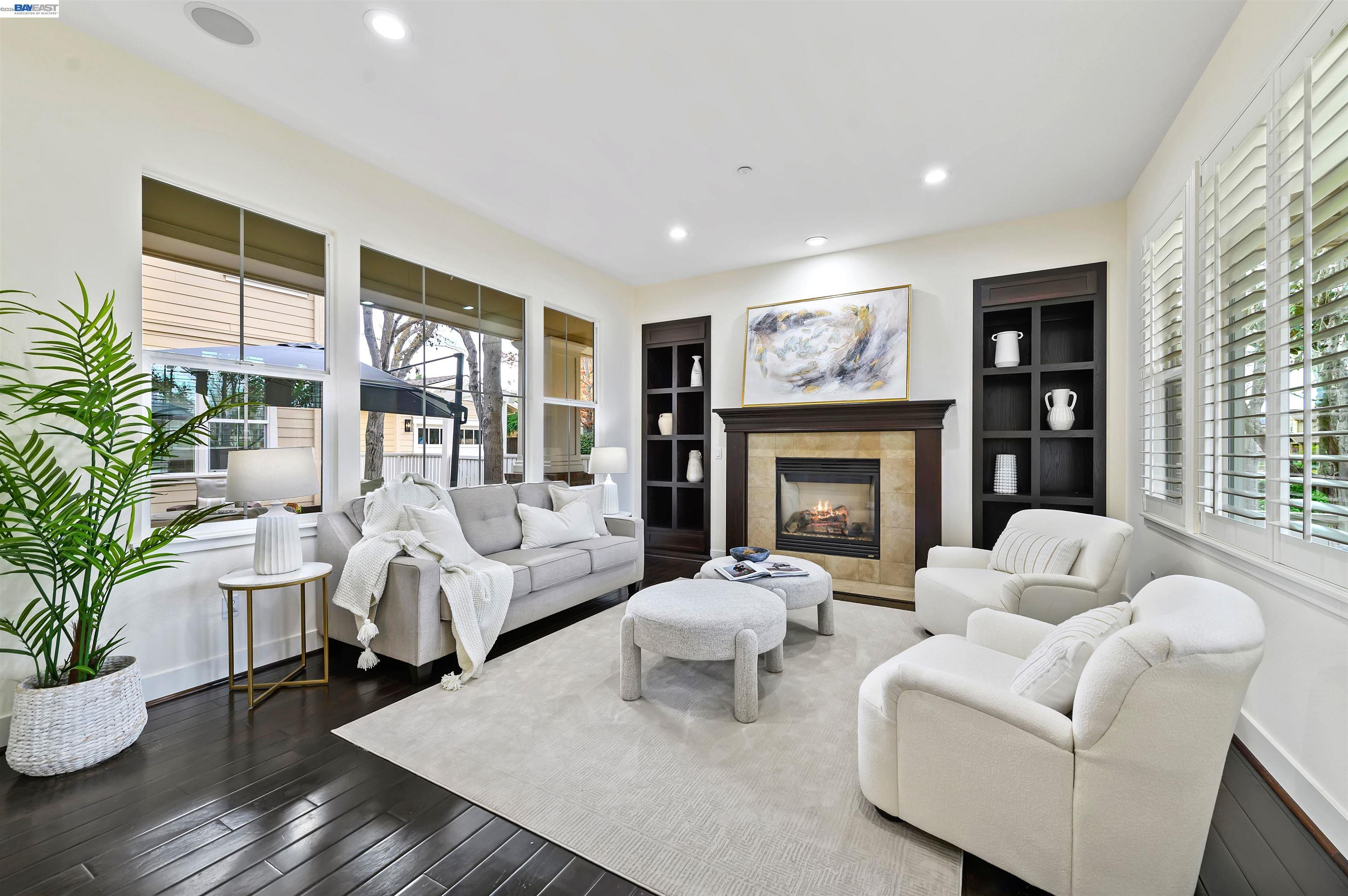5454 Stockton Loop Livermore, CA 94550 - Photo 11 of 35 a living room with furniture large window and potted plants