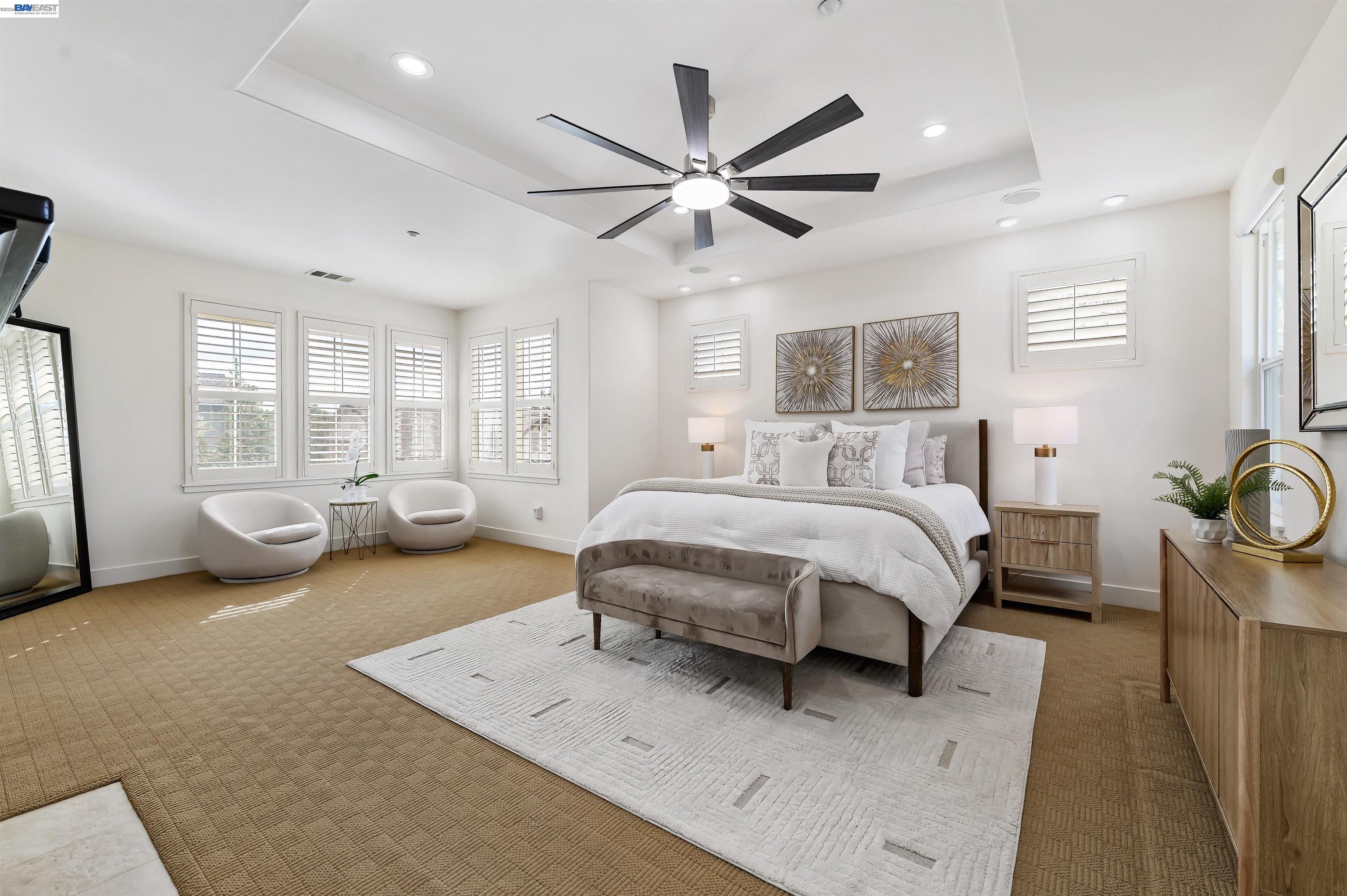 5454 Stockton Loop Livermore, CA 94550 - Photo 12 of 35 a spacious bedroom with a bed couch and window