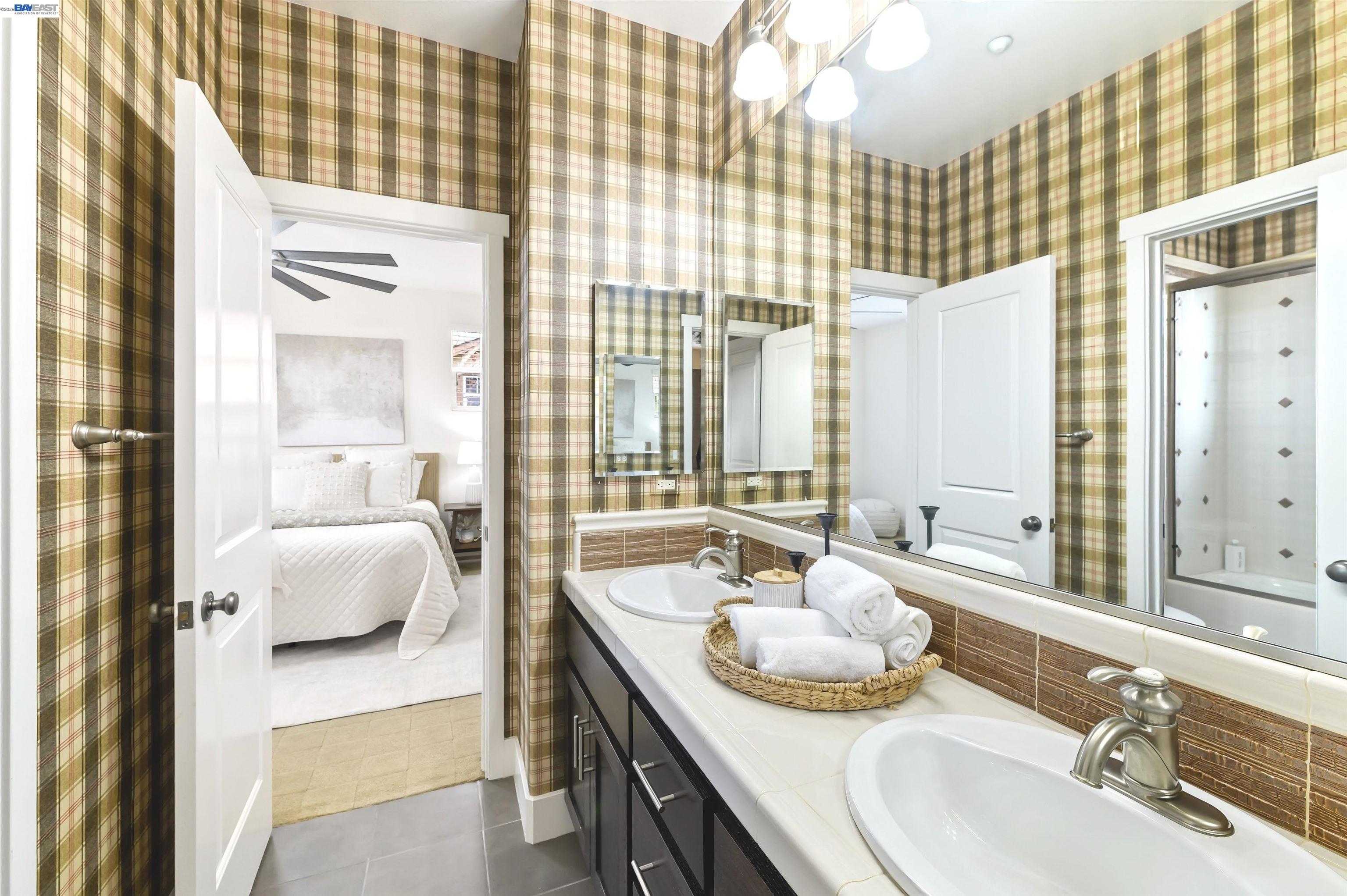 5454 Stockton Loop Livermore, CA 94550 - Photo 16 of 35 a bathroom with a granite countertop sink and a mirror