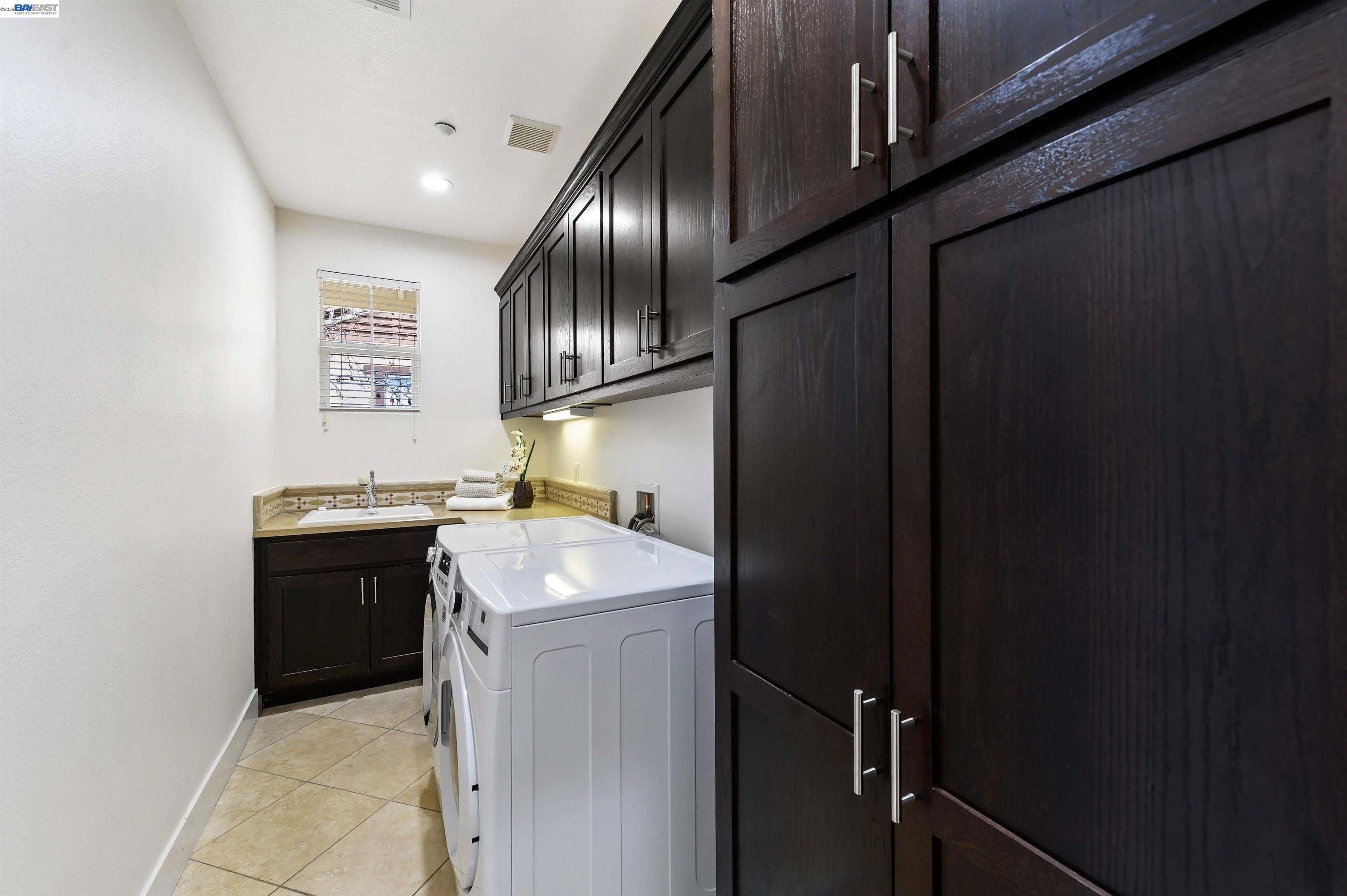 5454 Stockton Loop Livermore, CA 94550 - Photo 18 of 35 a kitchen with a sink and cabinets