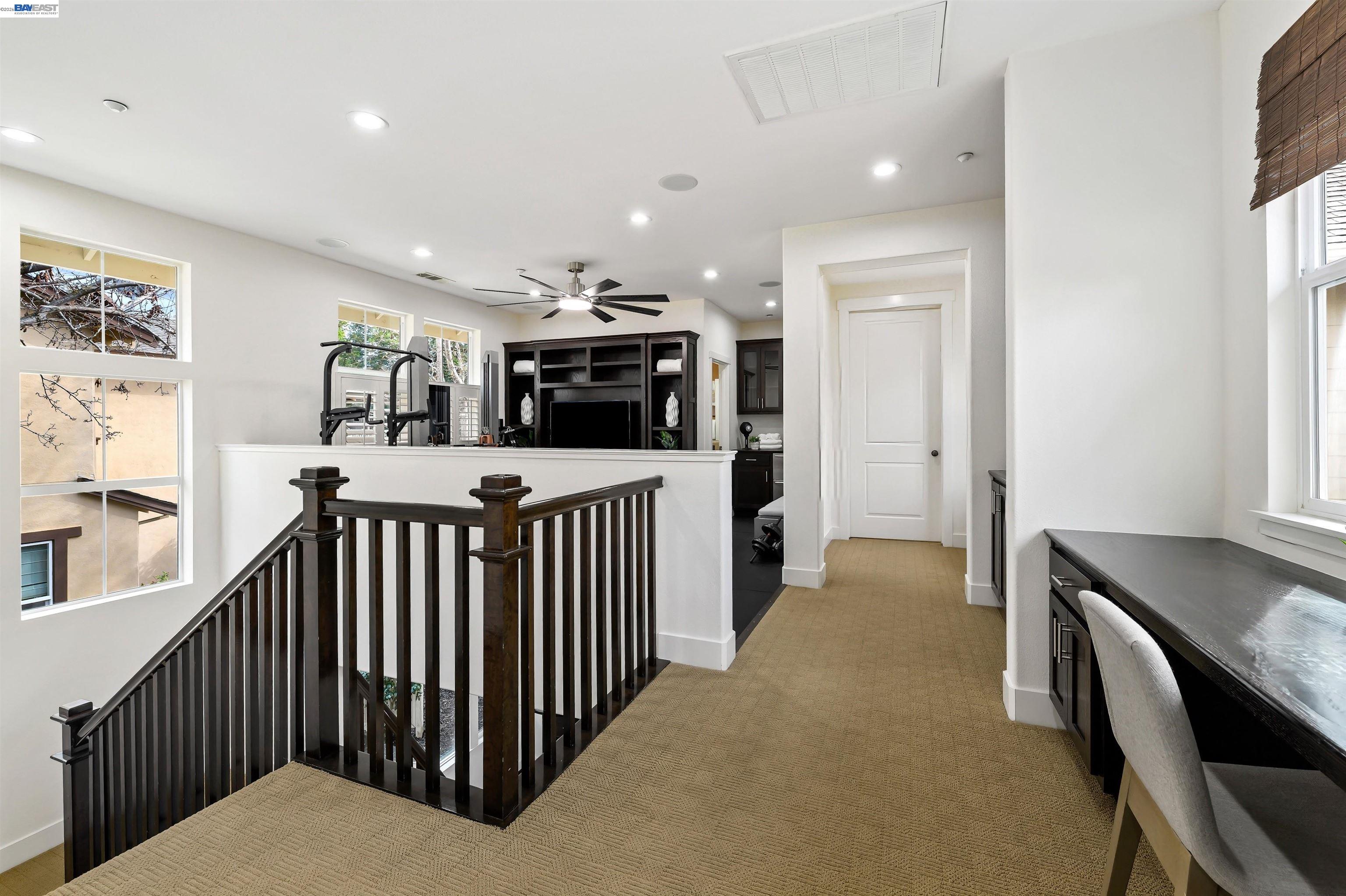 5454 Stockton Loop Livermore, CA 94550 - Photo 19 of 35 a view of a hallway with kitchen and chandelier