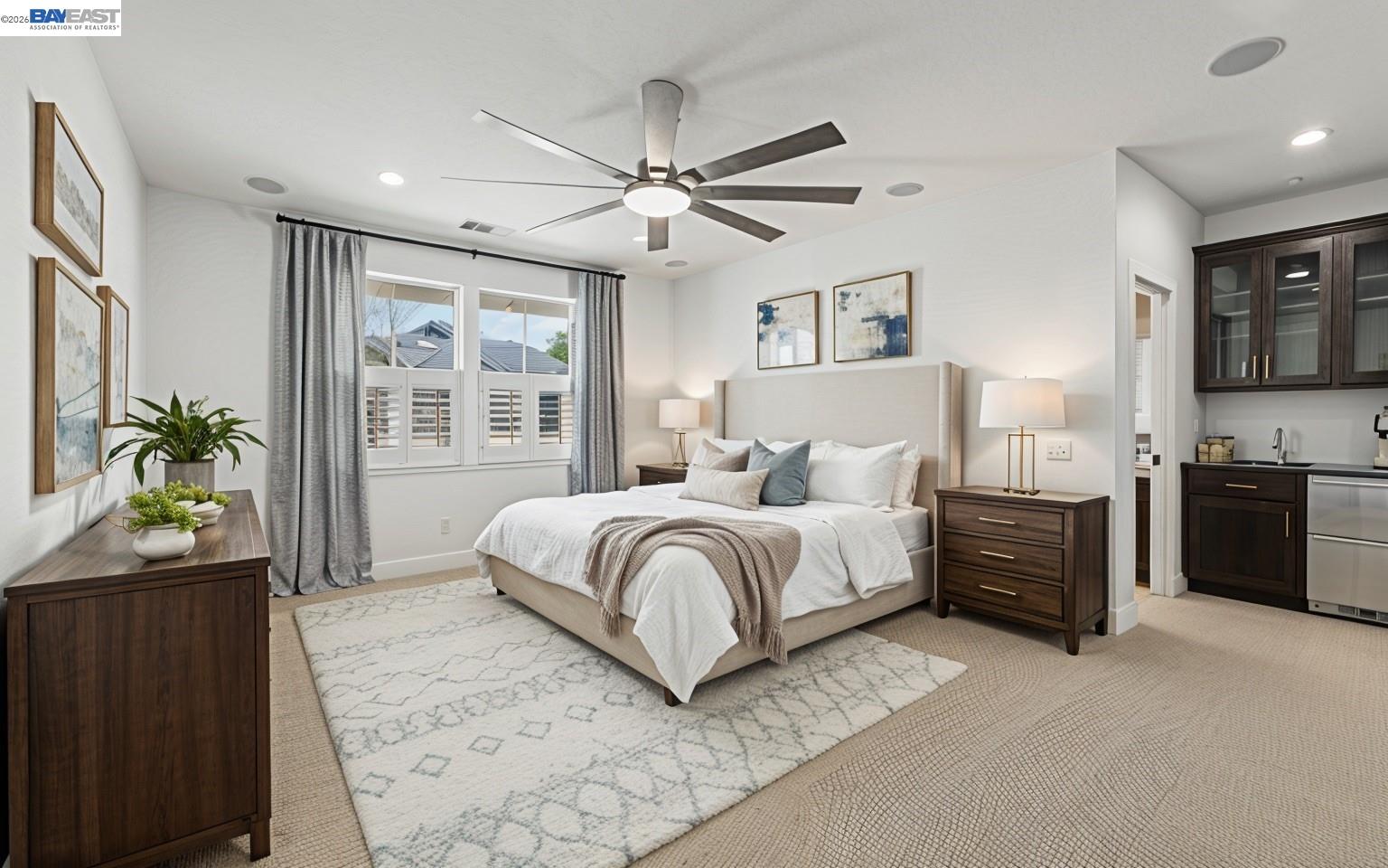 5454 Stockton Loop Livermore, CA 94550 - Photo 21 of 35 a spacious bedroom with a bed and a chandelier