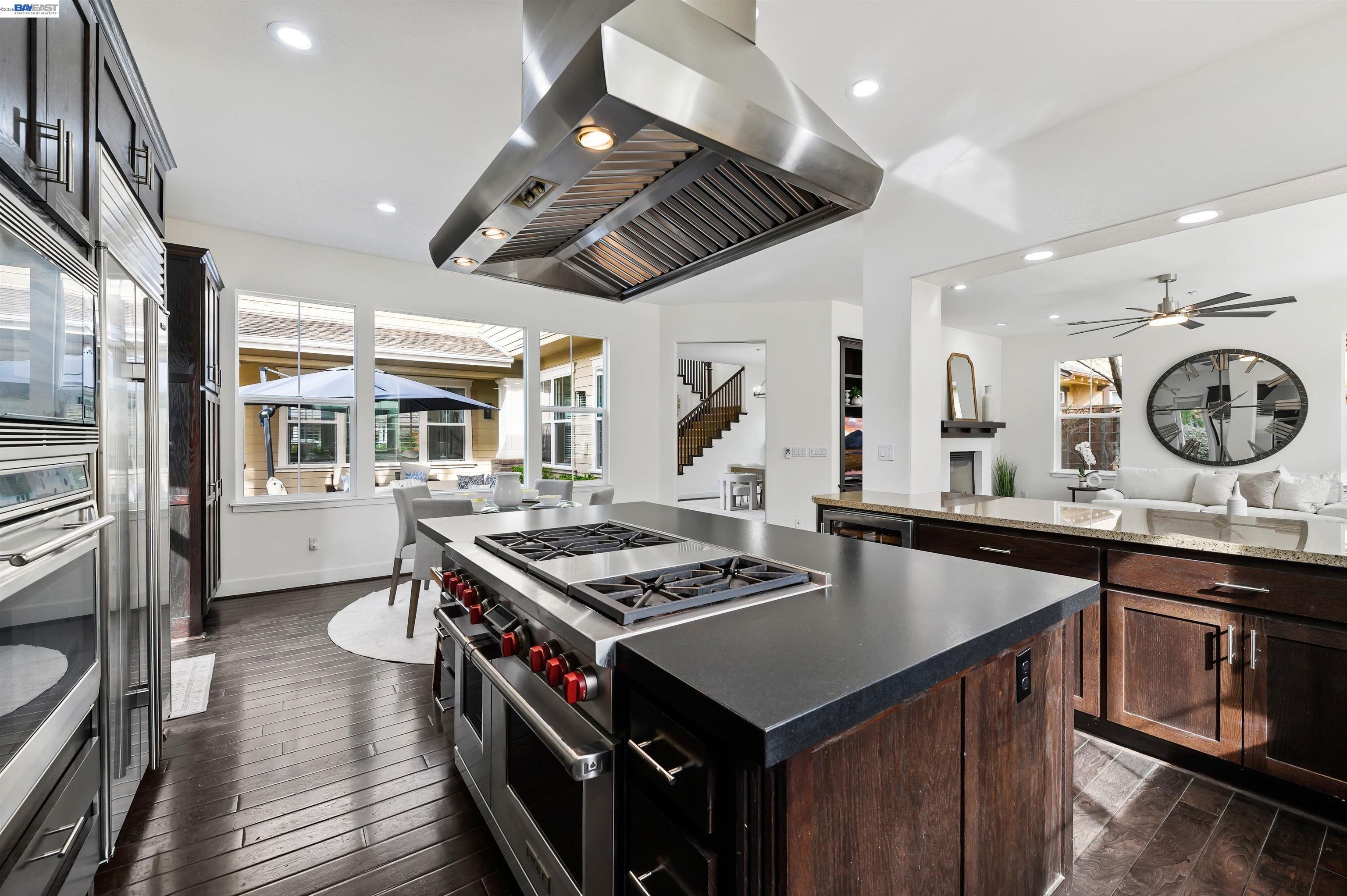 5454 Stockton Loop Livermore, CA 94550 - Photo 5 of 35 a kitchen that has a sink a stove and a wooden floors
