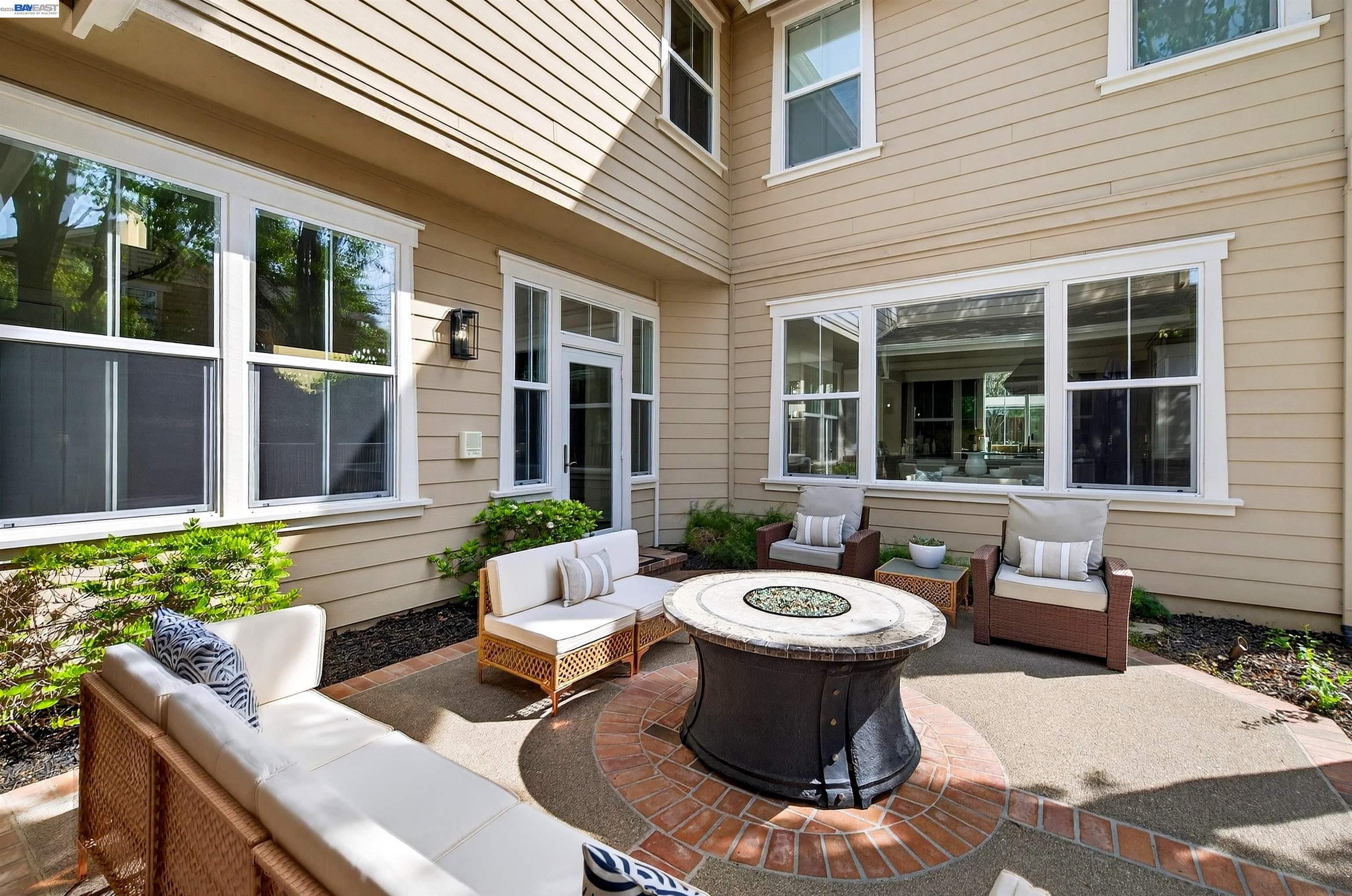 5454 Stockton Loop Livermore, CA 94550 - Photo 10 of 35 a view of a patio with couple of chairs and a fountain