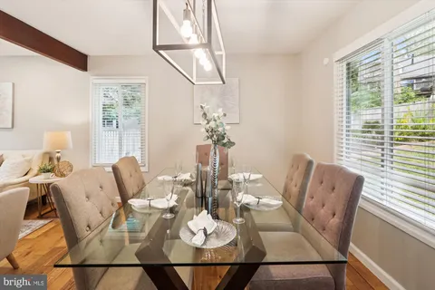 a kitchen with stainless steel appliances granite countertop a sink and a stove