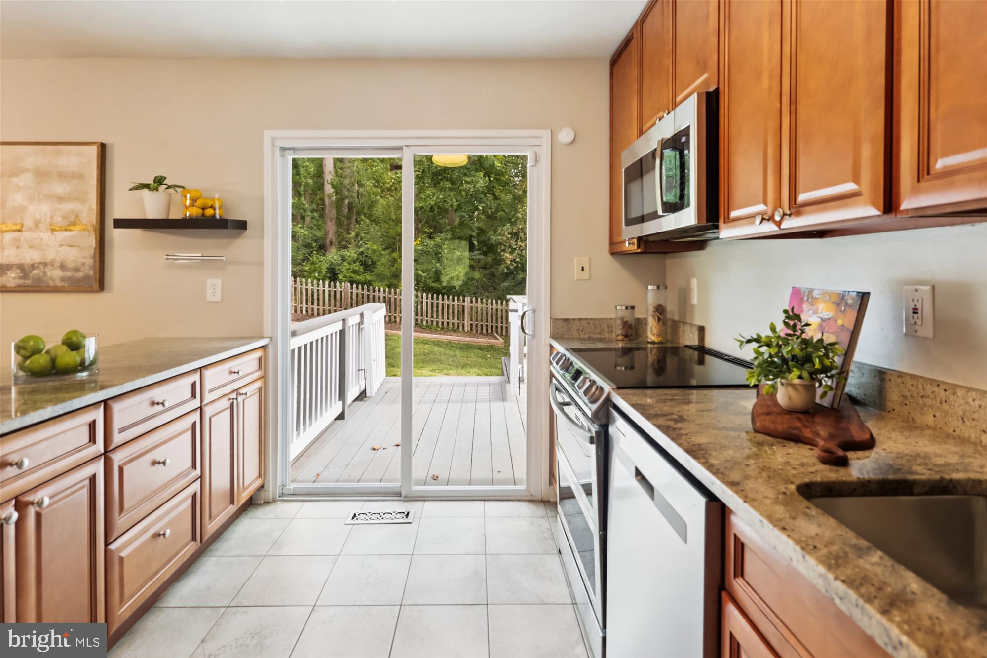 10105 Meredith Avenue Silver Spring, MD 20910 - Photo 16 of 76 a kitchen with stainless steel appliances granite countertop a sink and a stove