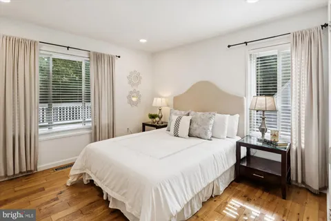 a bedroom with a bed and a lamp