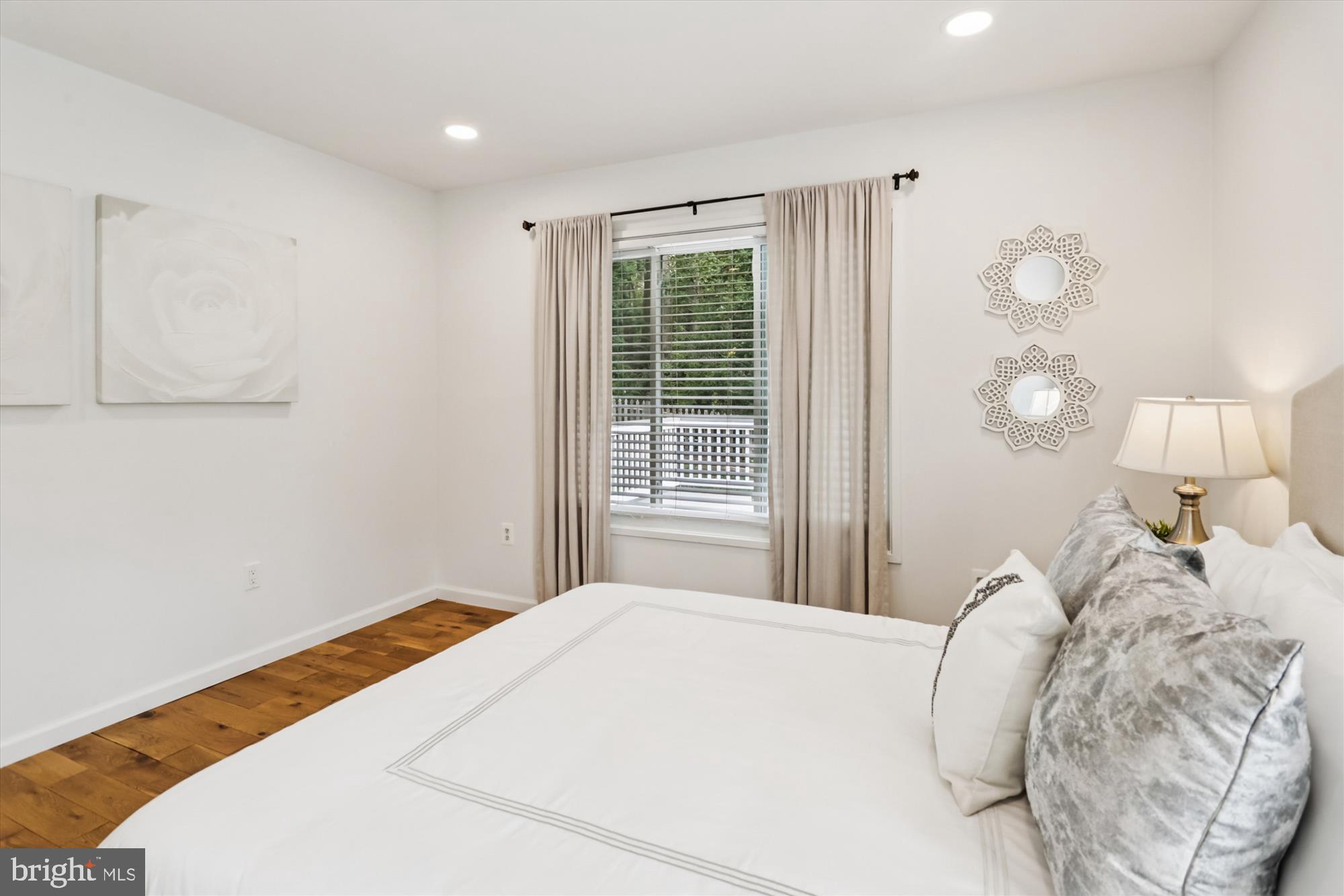 10105 Meredith Avenue Silver Spring, MD 20910 - Photo 22 of 76 a bedroom with a bed and a window