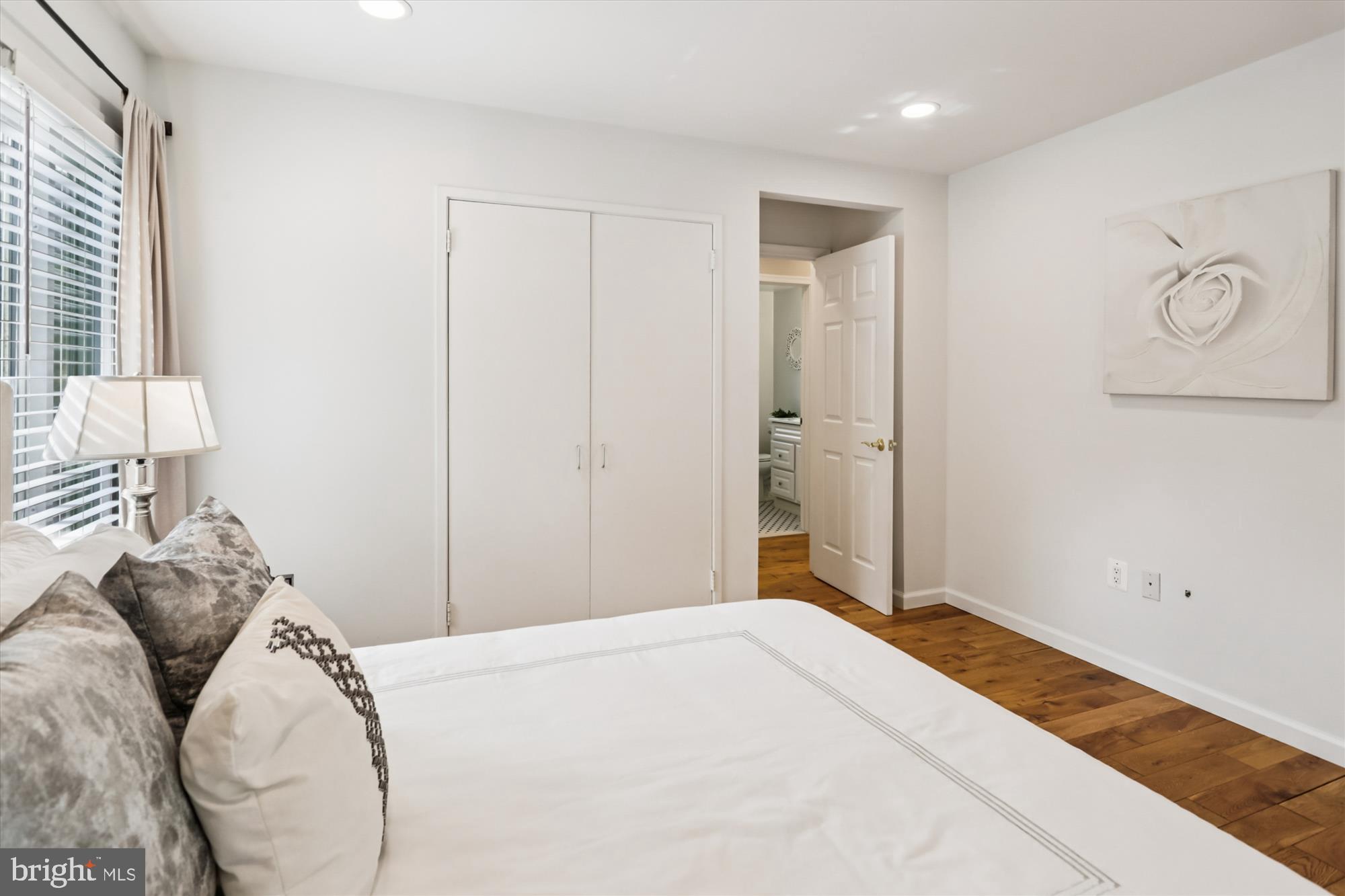 10105 Meredith Avenue Silver Spring, MD 20910 - Photo 23 of 76 a bedroom with a bed and a chandelier