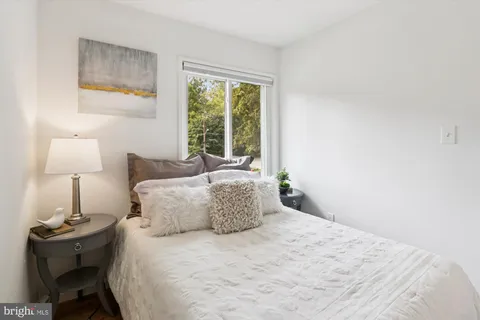 a bathroom with a sink mirror vanity and toilet
