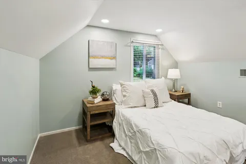 a view of a room with wooden floor and a window