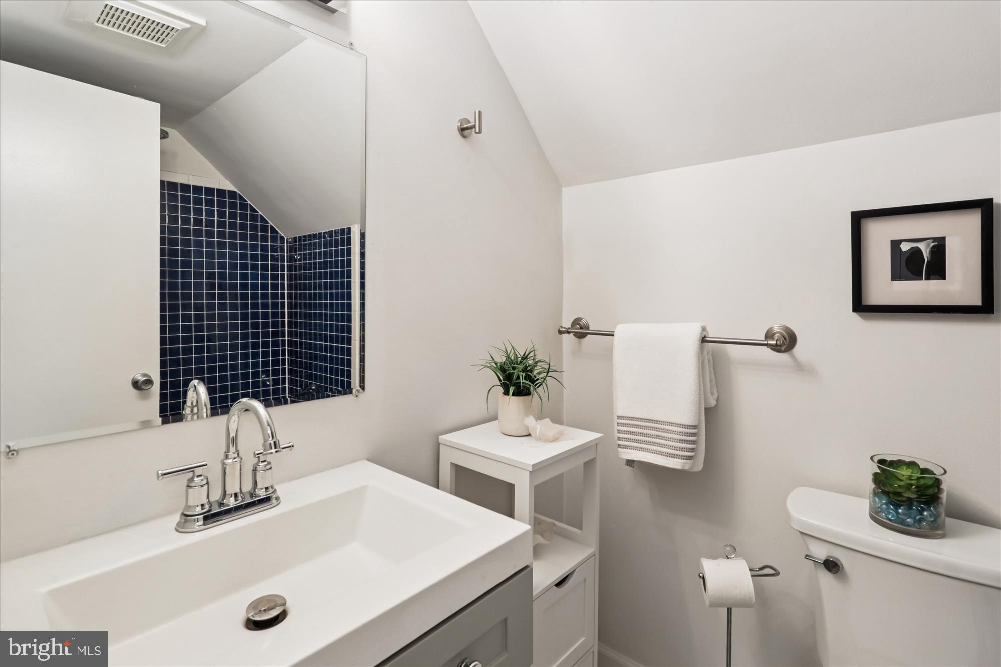 10105 Meredith Avenue Silver Spring, MD 20910 - Photo 37 of 76 a bathroom with a sink and a mirror
