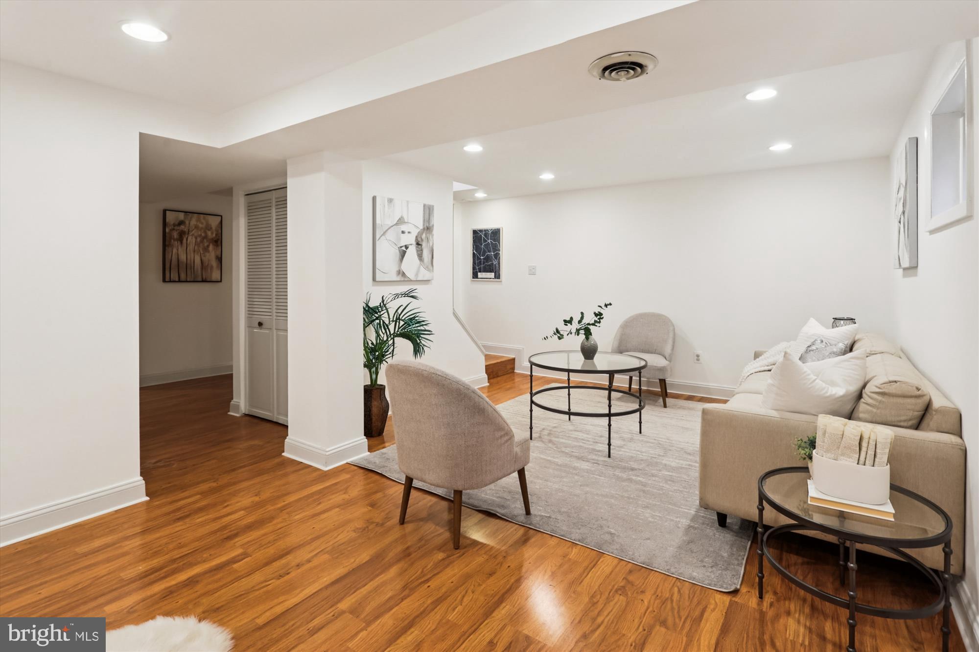 10105 Meredith Avenue Silver Spring, MD 20910 - Photo 45 of 76 a living room with furniture and a wooden floor