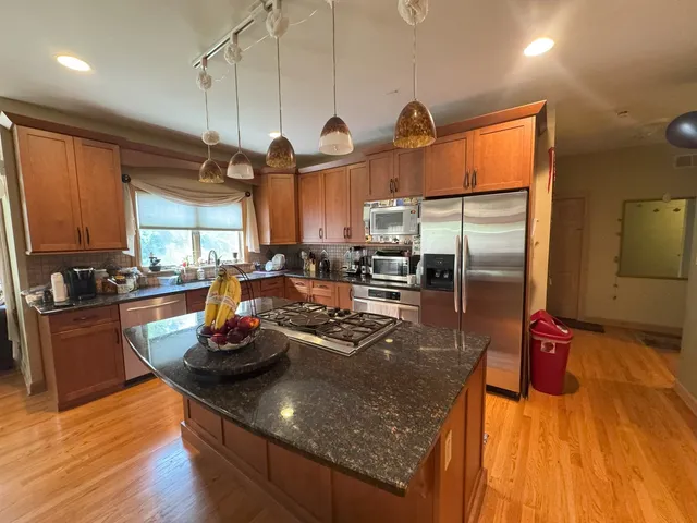 a view of kitchen with wooden floor