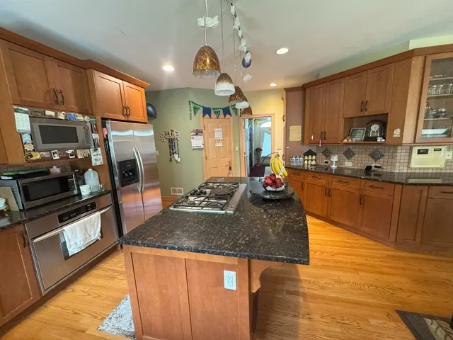 a large kitchen with a large window