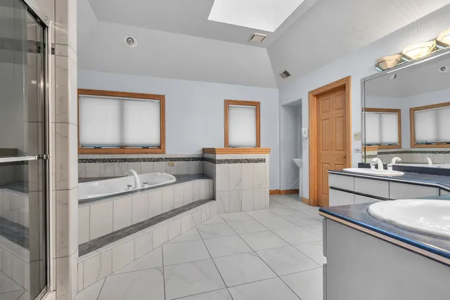 a living room with furniture and a dresser