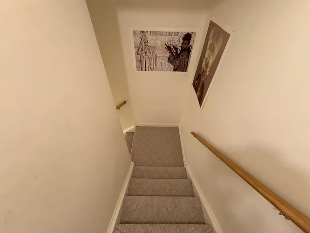 a bathroom with a shower sink vanity mirror and toilet