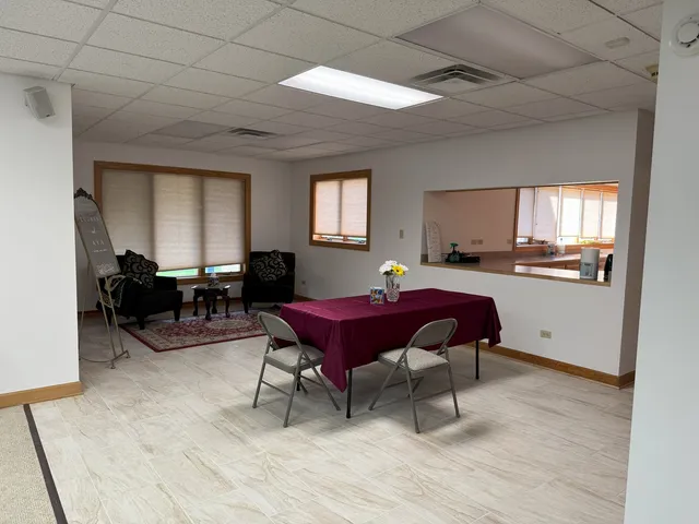 a balcony with wooden floor and fence