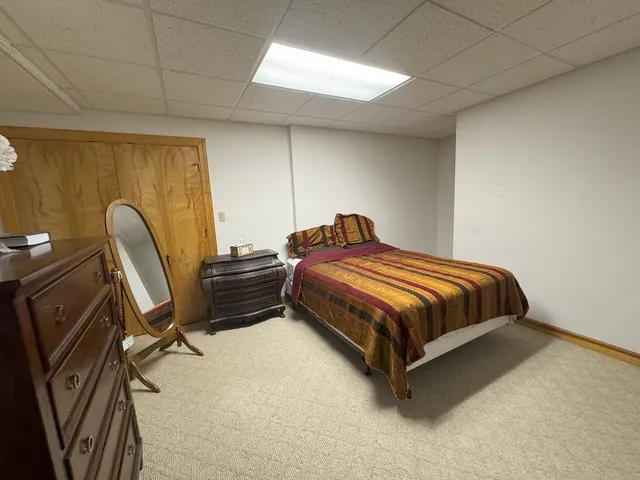 an aerial view of a house with a garden and trees