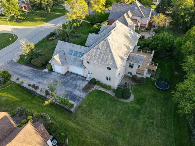 a kitchen with granite countertop a sink and a white wooden cabinets