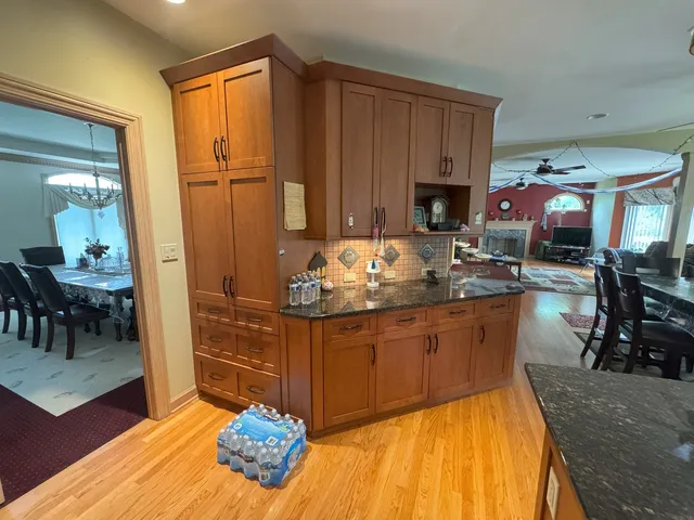 a kitchen with sink refrigerator and cabinets