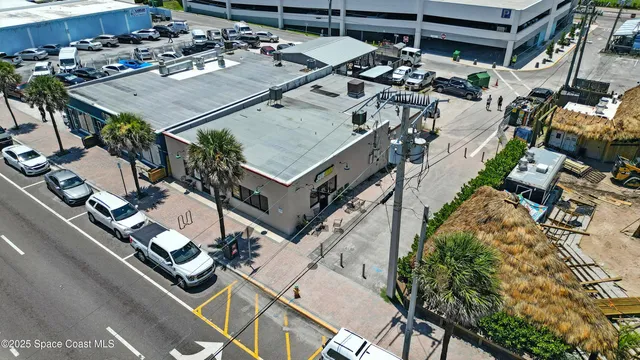 an aerial view of a house with outdoor space