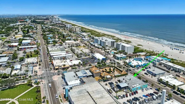 an aerial view of residential houses with outdoor space