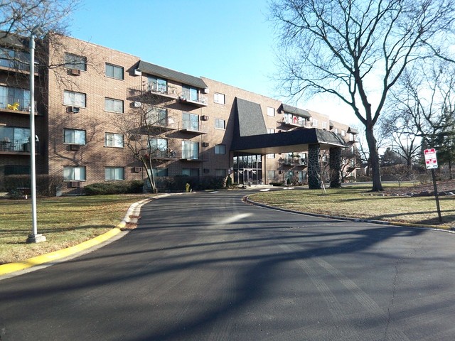 235 North Mill Road, Unit 106B Addison, IL 60101 - Photo 1 of 24 a view of a building with a pathway
