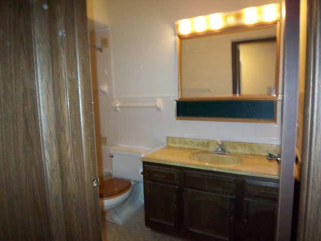 235 North Mill Road, Unit 106B Addison, IL 60101 - Photo 19 of 24 a bathroom with a sink and a mirror
