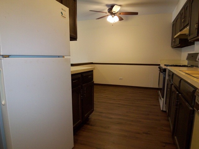235 North Mill Road, Unit 106B Addison, IL 60101 - Photo 3 of 24 a view of a storage & utility room with wooden floor