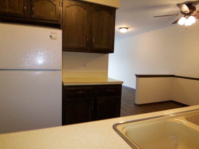 235 North Mill Road, Unit 106B Addison, IL 60101 - Photo 4 of 24 a kitchen with a refrigerator