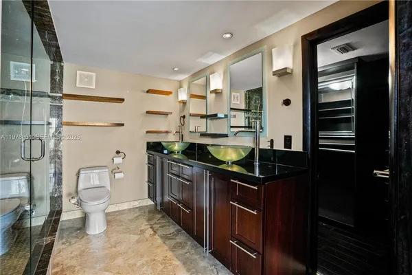 a kitchen with stainless steel appliances a refrigerator and stove