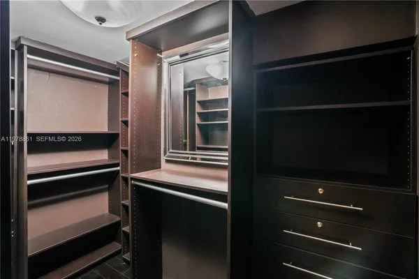 a kitchen with a refrigerator and an oven