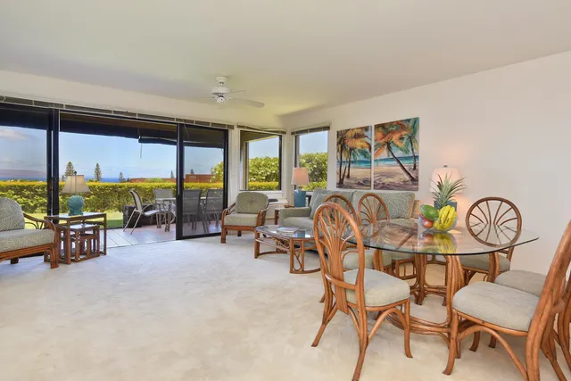 a view of a livingroom with furniture and a floor to ceiling window