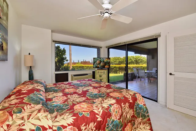 a bedroom with a bed and a table